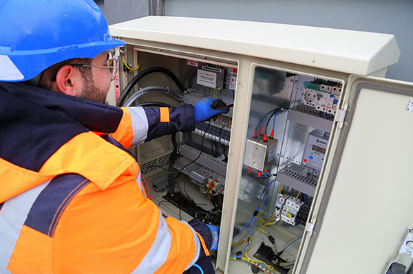 renovations Man Checking Electrical Panel Board